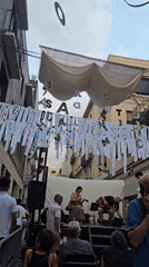 Live music and street decorations at a Barcelona neighborhood festival