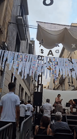 Live music and street decorations at a Barcelona neighborhood festival
