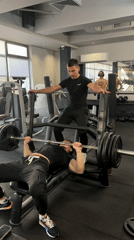 Men workout with spotter at Tsarevo gym