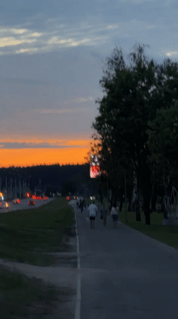 Evening pedestrians documented during dusk in Minsk, Belarus