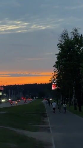 Evening pedestrians documented during dusk in Minsk, Belarus