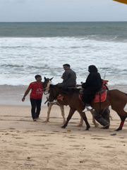 Horseback riding on a stormy Choeng Thale beach