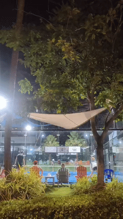 Nighttime paddle tennis draws spectators at Thai resort court