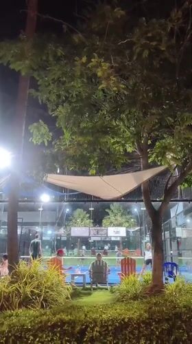 Nighttime paddle tennis draws spectators at Thai resort court