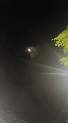 Two crescent lights observed in night sky over Kuta