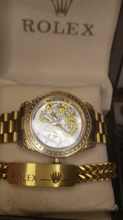 Gold dragon-dial Rolex and bracelet, shot repeatedly in Kaduna