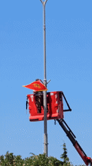 Worker installs Montenegro flag on street pole in Bar