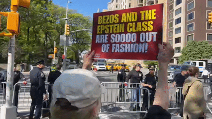 Daytime protest documented on NYC's Museum Mile amid sunny weather