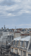Helicopter and drone share the skies above Paris rooftops