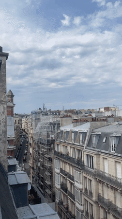 Helicopter and drone share the skies above Paris rooftops