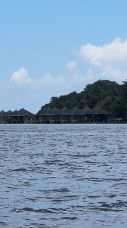 Overwater bungalows documented in choppy Maldivian waters