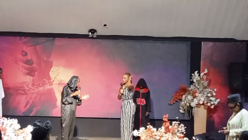 Stage performance with choir and speakers in Jos