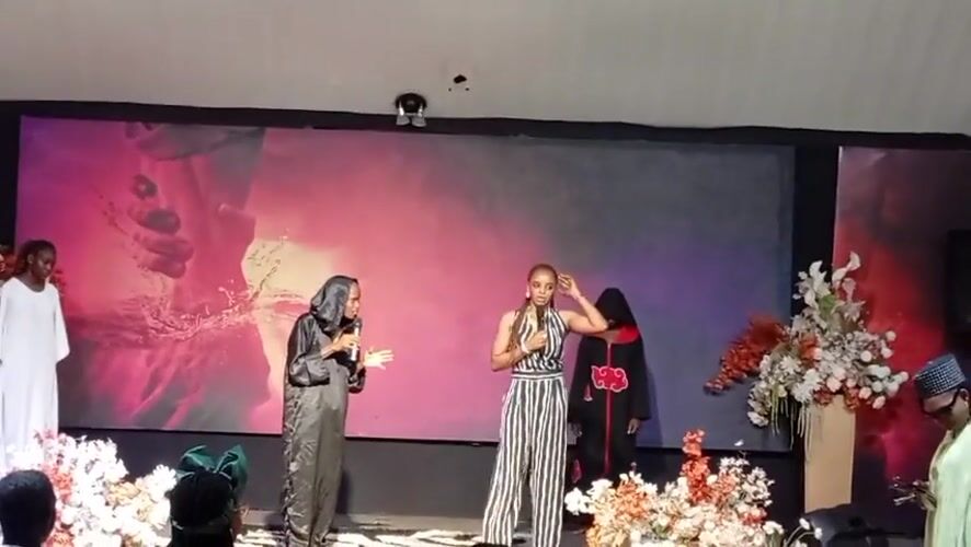 Stage performance with choir and speakers in Jos