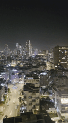 Evening aerial views document Bat Yam cityscape and coastline