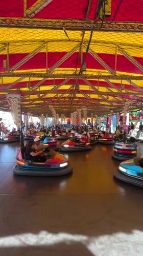 Families enjoy bumper car rides at Fuengirola amusement venue