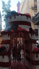 Giant cake display anchors a festive Barcelona street scene