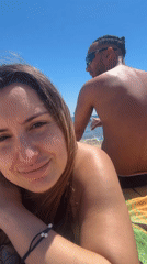Couple enjoys morning beach time in Barcelona