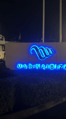 Rainy night at Marina Ibiza: superyachts and luxury boutiques