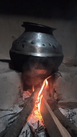 Cattle, cooking fires, and hillside views in rural Haini