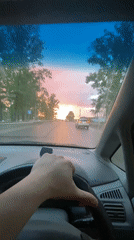 Vibrant sunset colors illuminate Irkutsk street scene