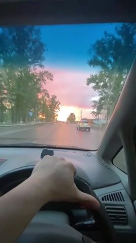 Vibrant sunset colors illuminate Irkutsk street scene
