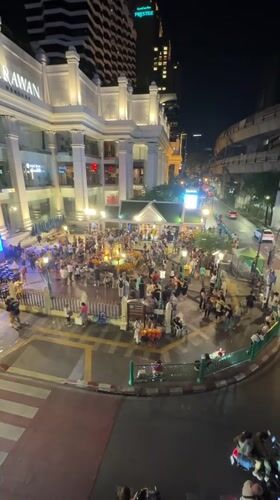 Crowds gather at Bangkok shrine and luxury store