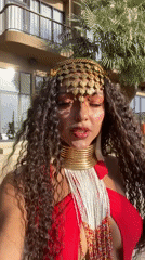 Red swimsuit meets ornate gold jewelry on Ko Samui