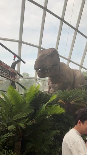 Tourists explore dinosaur exhibits and attractions at Singapore's Gardens