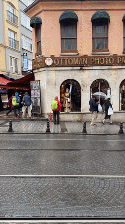 Rainy afternoon street life documented in Istanbul