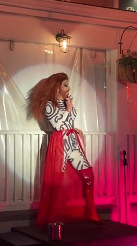 Drag performance lights up a Provincetown outdoor stage at night