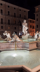 Bernini's Fountain of Four Rivers lit up at night, Piazza Navona