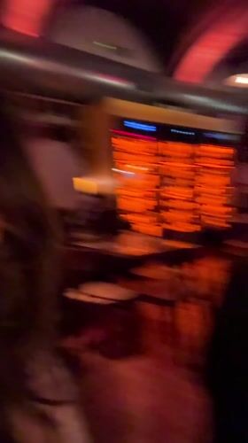 Young women dine at red-lit Milan restaurant Friday evening