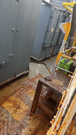 Witness documents flooded deck with rust stains, gray structures
