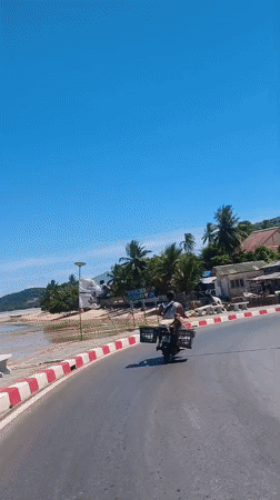 Motorcycles and temple gates: a quiet morning in Nathon