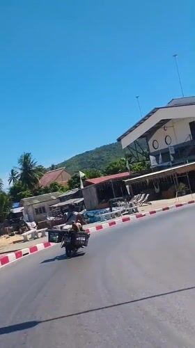 Motorcycles and temple gates: a quiet morning in Nathon