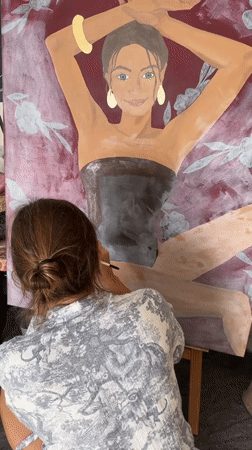 Artist captured painting large canvas in North Kuta studio