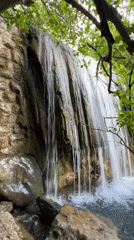 Visitors explore waterfall in Krapina, Montenegro