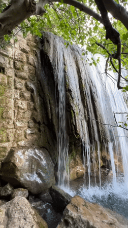 Visitors explore waterfall in Krapina, Montenegro