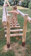 Kids playing on a wooden playground in Sokolov, Czechia