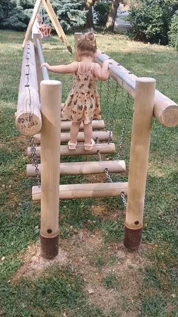 Kids playing on a wooden playground in Sokolov, Czechia