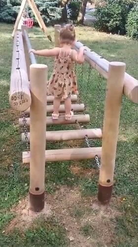 Kids playing on a wooden playground in Sokolov, Czechia