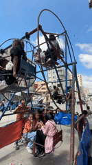 Makeshift Ferris wheel operates amid damaged Gaza buildings