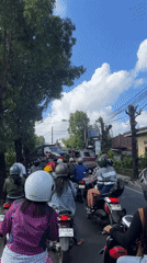 Traffic jam blocks Sukawati road as red truck stops