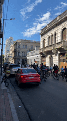 Young cyclists take over Buenos Aires street, perform tricks