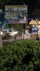 Nighttime street life around a Cirebon food stall and playground