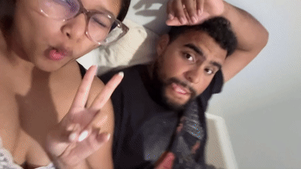 Couple documents evening at home with photos, TV, nail care