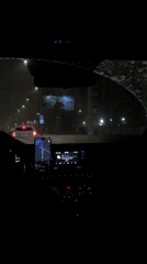 Nighttime car journey documented during snowfall in Perm, Russia
