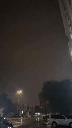 Thunderstorm with lightning strikes Abu Dhabi neighborhoods