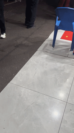 Police officers patrol outdoor commercial area in Shanghai