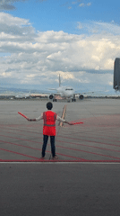 Ground crew marshals Lufthansa jet at Sofia Airport